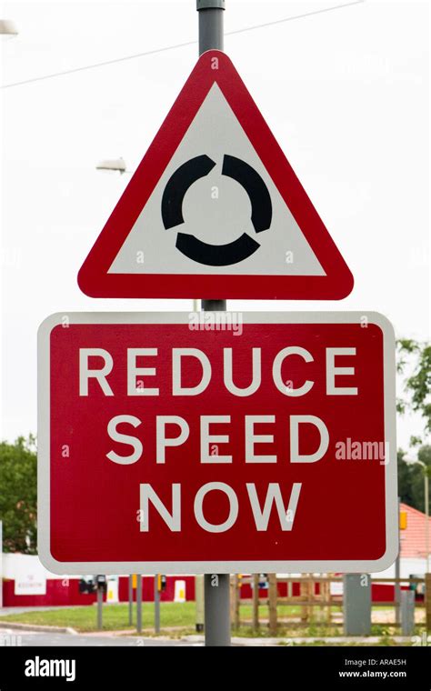 Reduce Speed Now Roundabout Ahead Road Sign Stock Photo Alamy