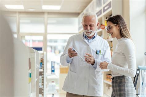 280 Pharmacist Talking To Patient With Mask Stock Photos Pictures