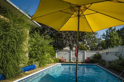 Yellow Umbrella and Water Pool Stock Photo - Image of blue, water ...