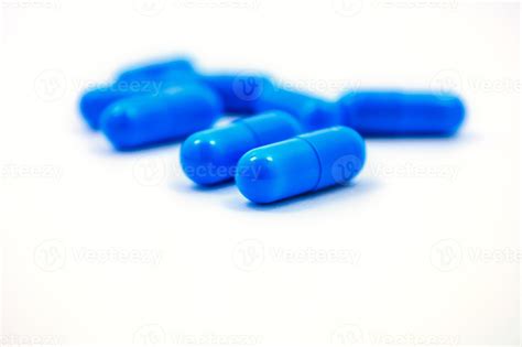 blue capsules on a white background 8317825 Stock Photo at Vecteezy