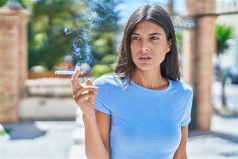 Young Beautiful Hispanic Woman Smoking at Street Stock Photo - Image of ...