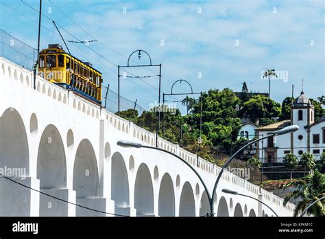 Train Drives Along Distinctive White Arches Of The Landmark Lapa Arches