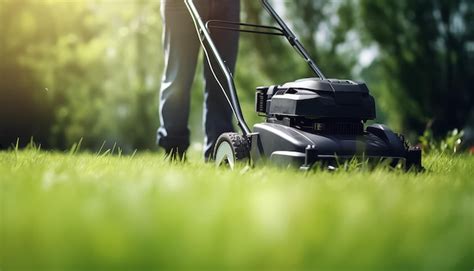 Premium Photo | Lawn mower mowing fresh green grass