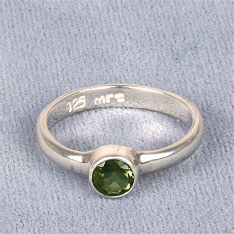 A Moldavite Faceted Gemstone Rings Round 5mm In Sterling Silver