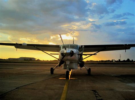 Free Images Wing Sun Sunset Airplane Tarmac Orange Vehicle