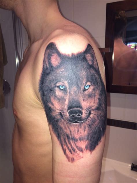 Wolf tattoo with blue eyes | Wolf tattoos men, Tattoos, Wolf tattoo