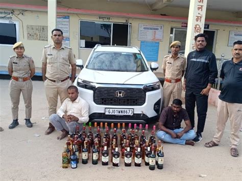 Alcohol Smuggling In Luxury Car Liquor Worth Rs 1 5 Lakh Hidden In Bonnet Seized 2 Smugglers