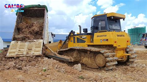 Best View Of Dump Truck Unloading Dirt Shantui Bulldozer Operator