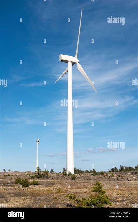 Wind Turbine Against Blue Sky Stock Photo Alamy