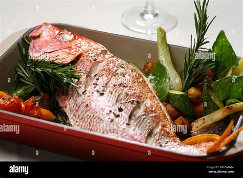 Baked Fish With Vegetables Stock Photo Alamy