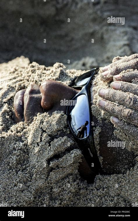 Man Being Buried In Sand On Kuta Beach Bali Stock Photo Alamy