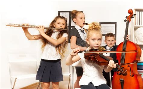 School Children Play Musical Instruments Together Stock Image - Image ...