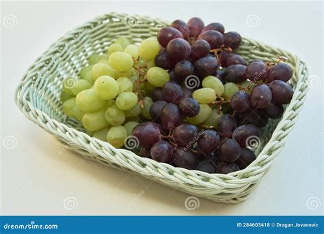 A basket of grapes stock photo. Image of crop, berry - 284603418