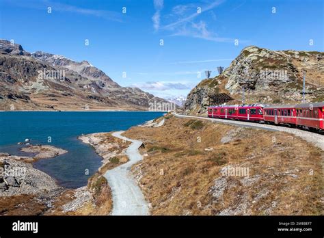 bernina express mountain railway train passing lago bianco Stock Photo ...