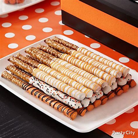 Dip Pretzel Sticks In Melted Candy Then Drizzle With Sprinkles And More