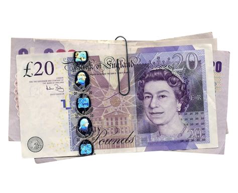 Premium Photo | Pound notes and coins, United Kingdom