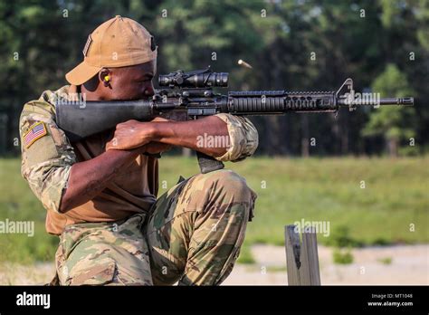 U S Army Private St Class Andre Matthews Fires An M A Rifle During