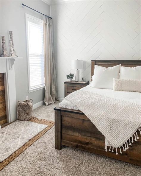 Relaxing Bedroom With White Wooden Herringbone Shiplap Accent Wall