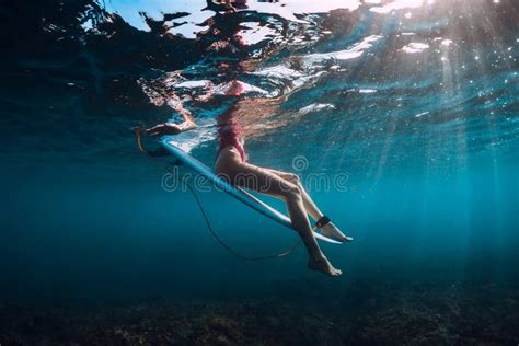 Surfer Girl With Surfboard Dive Underwater With Under Barrel Ocean Wave