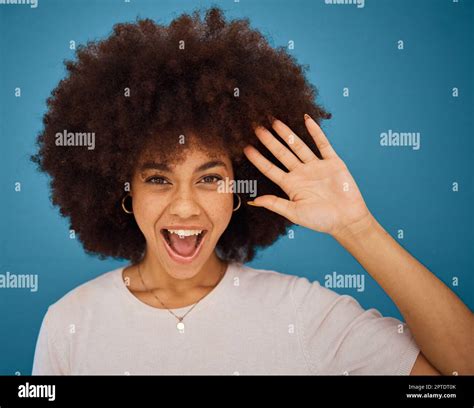 Brazilian Woman Afro Or Surprise Face On Blue Background In Studio In