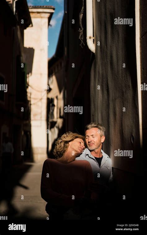 Mature Couple Enjoying Sunlight On Face Stock Photo Alamy