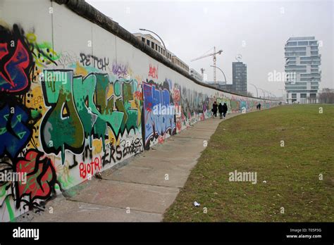 Berlin Wall Graffiti art at the East Side Gallery on Western face of ...