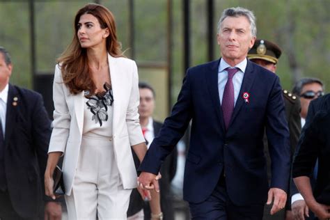 Argentina's President Mauricio Macri (R) and his wife Juliana Awada arrive to the ceremony ...