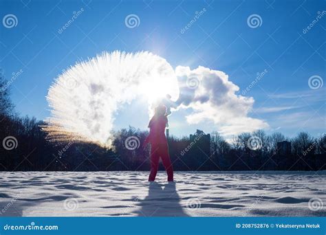 Person Pouring Hot Water Up In The Sky Sunny Winter Day Boiling Water Challenge Which Instantly