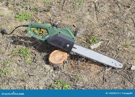 Sawn electric sawing tree stock photo. Image of cutting - 142035514