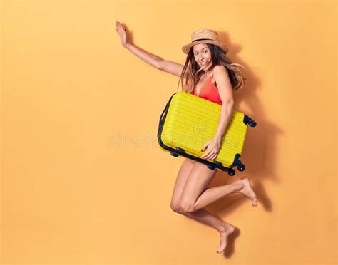 Young Beautiful Woman On Vacation Wearing Bikini And Hat Smiling Happy