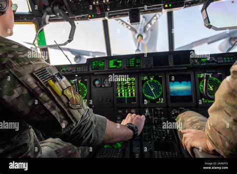 Flight crew in the cockpit of a US Air Force MC-130J Commando II from ...