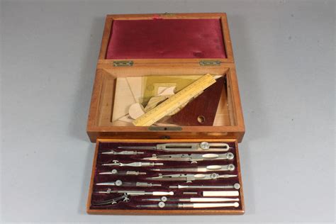 Lot No 336 A Victorian Polished Steel Geometry Set Contained In A Mahogany Box With Hinged Lid £