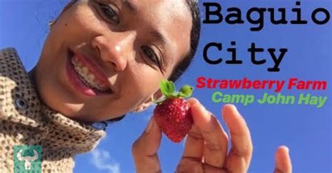 A Woman Holding Up A Strawberry In Her Hand With The Caption Baguio