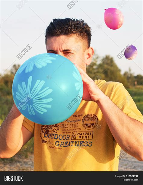 Man Inflates Blue Image And Photo Free Trial Bigstock