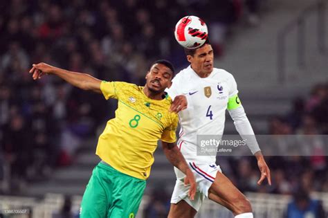 Lyle Foster of South Africa competes for the ball with Raphael Varane ...