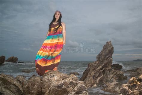 Asian Plus Size Fat And Overweight Woman In A Colorful Dresses Standing