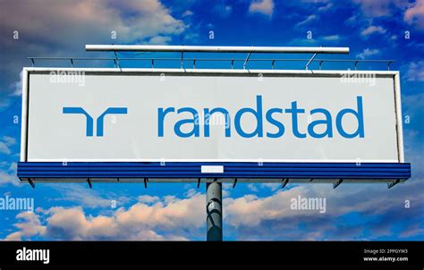 Advertisement billboard displaying logo of Randstad Stock Photo - Alamy