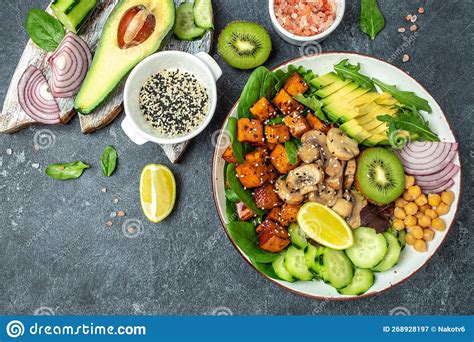 Healthy Vegetable Lunch In A Buddha Bowl With Tofu Avocado Chickpeas Cucumber And Mushrooms