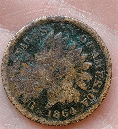 I found this bad boy in a bank roll of pennies. Can anyone tell if it's ...