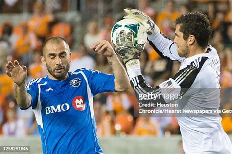 Houston Dynamo goalkeeper Tally Hall takes the ball away from... News ...