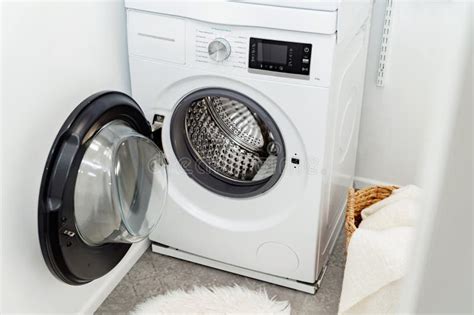 Open Door of Front Load Washing Machine in Laundry Room. Stock Photo ...