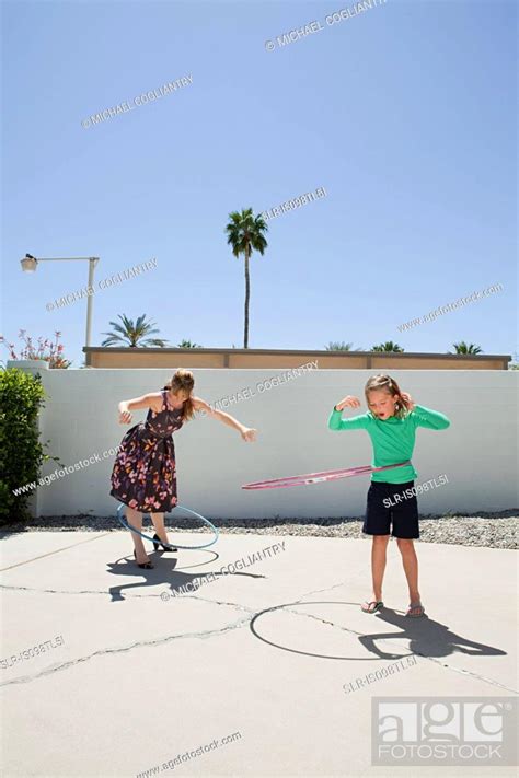 Mother And Daughter With Hoola Hoops Stock Photo Picture And Royalty