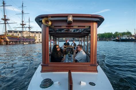 Small Boat Tours Amsterdam in a classic canal boat. Private boat rental.