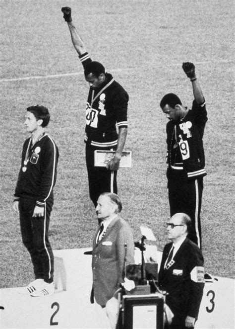 American Sprinters Tommie Smith And John Carlos Raise Their Fists And