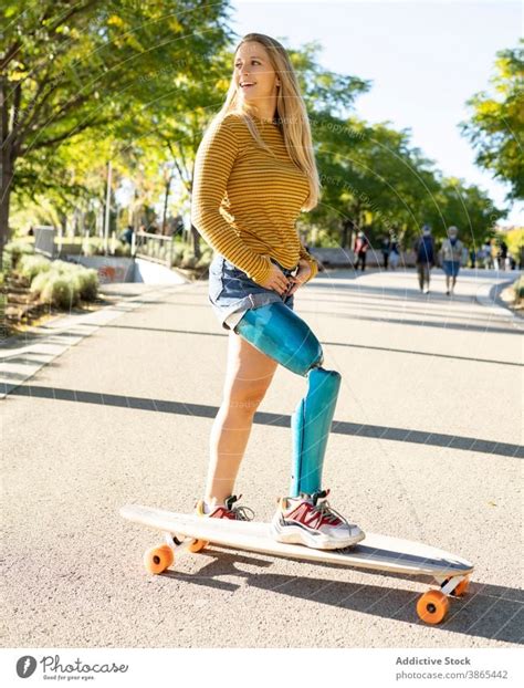 Smiling Woman Riding Longboard In City A Royalty Free Stock Photo