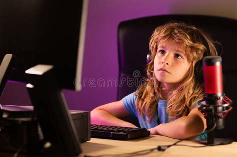 Little Child Gamer Play Computer Game On Desktop Gaming Stream And