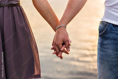 Happy couple holding hands Stock Photo | Adobe Stock