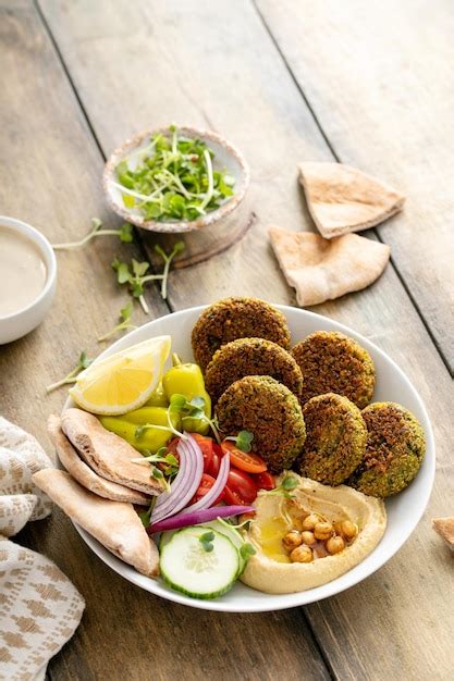 Premium Photo Baked Falafel Bowl With Hummus And Vegetables