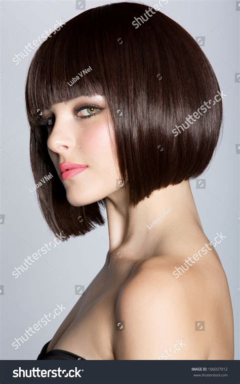 Portrait Of A Beautiful Woman In Short Brunette Bob With Neat Clean Hair On Studio Background