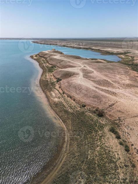 Kuimazar Reservoir Shoreline Landscape In Uzbekistan With Blue Water